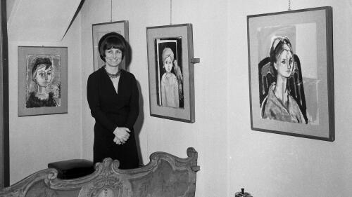 FILE - Artist Francois Gilot poses with her work at a personal art exhibition in Milan, Dec. 21, 1965. Gilot, a prolific and acclaimed painter who produced art for well more than a half-century but was nonetheless more famous for her turbulent relationship with Pablo Picasso — and for leaving him — died Tuesday, June 6, 2023, in New York, where she had lived for decades. She was 101. (AP Photo, File)