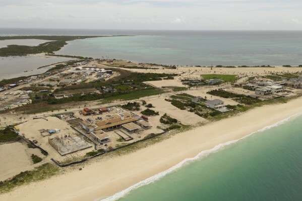 View of the Barbuda Ocean Club at Coco Point next to Princess Diana beach in Barbuda, Antigua and Barbuda, Monday, Oct. 23, 2023. When Hurricane Irma slammed into the tiny Caribbean island as a powerful Category 5 storm in 2017, the government temporarily evacuated the entire population of some 1,600. Before many of them had trickled back, U.S. developers were allowed in and permitted to build an airport and luxury resort, a project that has angered islanders and that the U.N. warns is a danger to a wetland and other fragile environments. (AP Photo/Mohammid Walbrook)