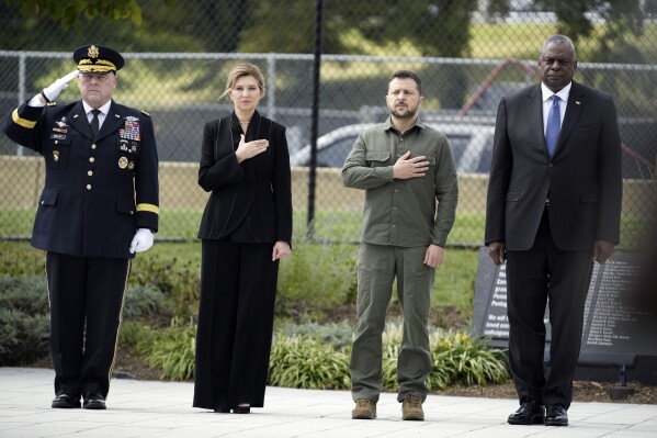 FILE - From left, Chairman of the Joint Chiefs Gen. Mark Milley, first lady of Ukraine Olena Zelenska, Ukrainian President Volodymyr Zelenskyy and Secretary of Defense Lloyd Austin, participate in a wreath-laying ceremony at the 9/11 Pentagon Memorial, Thursday, Sept. 21, 2023, in Washington. (AP Photo/Andrew Harnik, File)