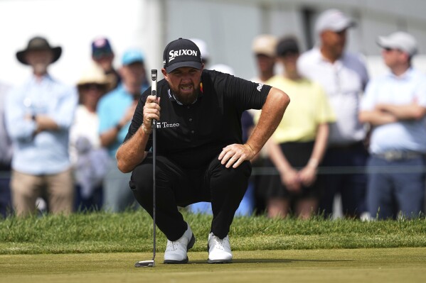 Shane Lowry, of Ireland, prepares to putt on the sixth hole during the final round of the Truist Championship golf tournament at the Philadelphia Cricket Club, Sunday, May 11, 2025, in Flourtown. (AP Photo/Matt Rourke)
