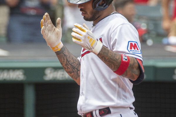 Cleveland Guardians' Gabriel Arias celebrates after hitting a two-run home run off Chicago White Sox starting pitcher Jesse Scholtens during the fifth inning of a baseball game in Cleveland, Sunday, August 6, 2023. (AP Photo/Phil Long)