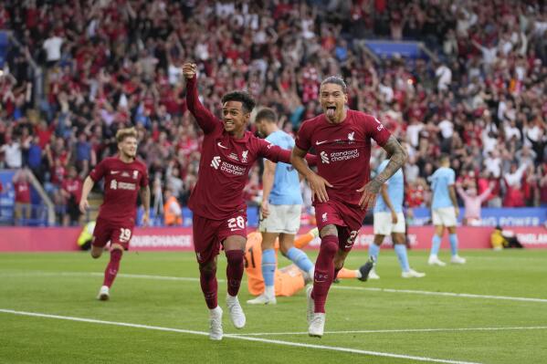 Liverpool's Darwin Nunez, right, celebrates after scoring his side's third goal during the FA Community Shield soccer match between Liverpool and Manchester City at the King Power Stadium in Leicester, England, Saturday, July 30, 2022. (AP Photo/Frank Augstein)