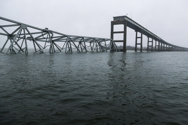 Part of the collapsed Francis Scott Key Bridge stand, Wednesday, April 3, 2024, in Baltimore. (AP Photo/Julia Nikhinson)