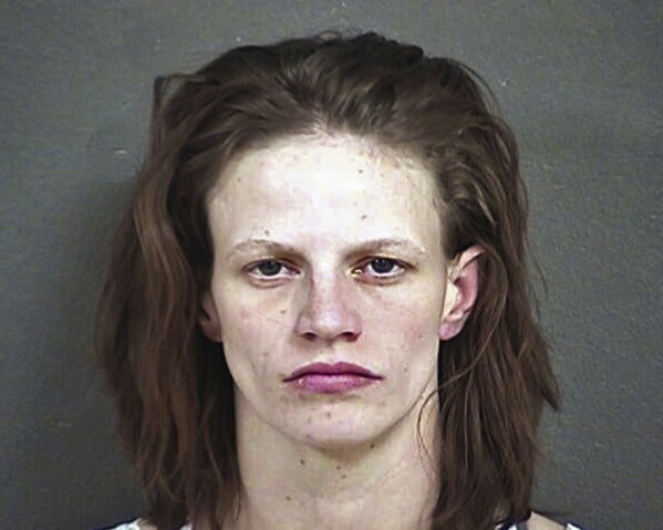 FILE - This undated file photo provided by the Wyandotte County Detention Center in Kansas City, Kan., shows Heather Jones. Kansas will pay $1 million to settle a lawsuit over the 2015 murder of 7-year-old boy Adrian Jones who authorities said was starved and tortured before his body was fed to pigs. Gov. Laura Kelly and top leaders of the Kansas Legislature approved the settlement during a brief public meeting Tuesday, March 12, 2024 after conferring privately with the attorney general's office. Heather Jones was Adrian's stepmother. (Wyandotte County Detention Center via AP, File)