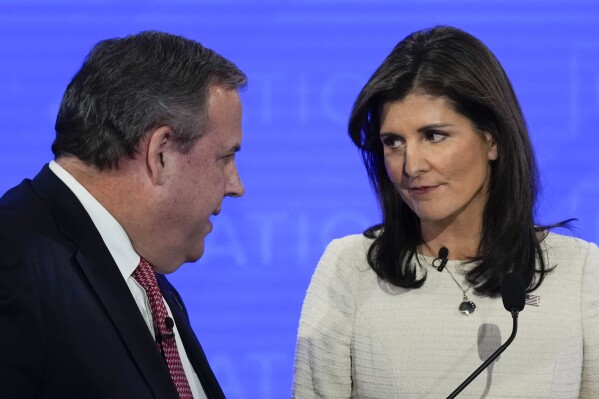 Republican presidential candidates, former New Jersey Gov. Chris Christie, left, talking with former U.N. Ambassador Nikki Haley, right, during a commercial break at a Republican presidential primary debate hosted by NewsNation on Wednesday, Dec. 6, 2023, at the Moody Music Hall at the University of Alabama in Tuscaloosa, Ala. (APPhoto/Gerald Herbert)