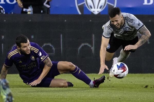 Orlando City defender Kyle Smith, left, and CF Montreal defender Aaron Herrera collide during the first half of an MLS soccer game in Montreal, Saturday, May 6, 2023. (Allen McInnis/The Canadian Press via AP)