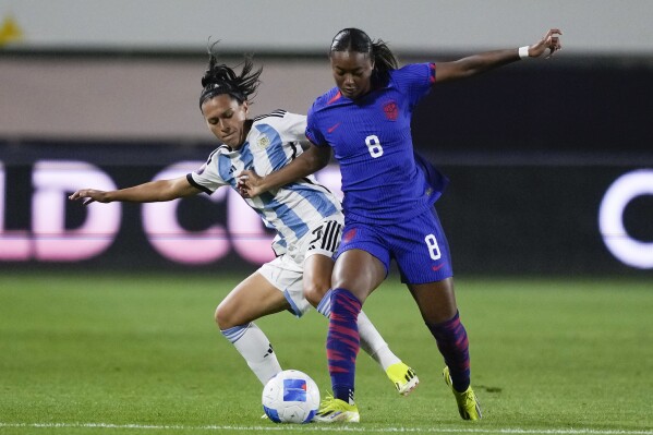 United States forward Jaedyn Shaw, right, and Argentina defender Eliana Stábile vie for the ball during the first half of a CONCACAF Gold Cup women's soccer tournament match Friday, Feb. 23, 2024, in Carson, Calif. (AP Photo/Ryan Sun)