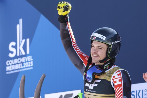 Canada's James Crawford celebrates winning an alpine ski, men's World Championship super-G race, in Courchevel, France, Thursday, Feb. 9, 2023. (AP Photo/Alessandro Trovati)