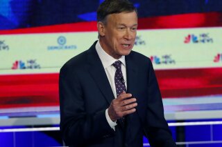 FILE - In this June 27, 2019 file photo, Democratic presidential candidate and former Colorado Gov. John Hickenlooper speaks during the Democratic primary debate hosted by NBC News at the Adrienne Arsht Center for the Performing Arts, in Miami. Hickenlooper says of his presidential campaign struggles that “the vast majority of the problem with the campaign was me.” But the Democrat promised Sunday, July 7 to stay in the race and become a better candidate. His own staff has called for him to exit the presidential race and run for Senate instead.  (AP Photo/Wilfredo Lee, File)