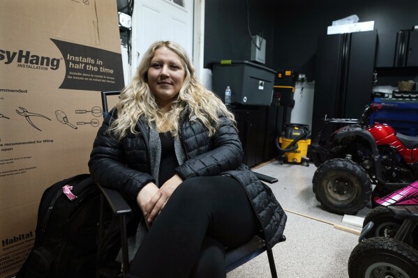Lisa Hohnstreiter sits for a portrait in Warren, Mich., on Friday, Nov. 24, 2023. (AP Photo/Carlos Osorio)