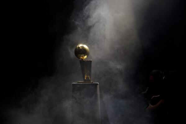 FILE - The NBA Championship trophy is on display at the public celebration in Miami for the Miami Heat after the team won the championship June 25, 2012. (AP Photo/J Pat Carter, File)