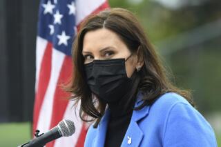FILE - This April 12, 2021, file photo shows Michigan Governor Gretchen Whitmer in Ypsilanti, Mich. Michigan legislators gave final approval Tuesday, June 1, 2021, to a bill that would exempt high school graduation ceremonies from a state order that restricts crowd sizes due to the coronavirus pandemic. The measure could be vetoed by Democratic Gov. Gretchen Whitmer. (Lon Horwedel/Detroit News via AP)