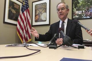 FILE - Rep. Jim Cooper, D-Tenn., talks to reporters at his Nashville office, on Feb. 16, 2018. Cooper says he won't run for reelection after serving in elected office for more than 30 years. Cooper announced that there was "no way" for him to win his seat under a new congressional map drawn up by state Republicans. (AP Photo/Jonathan Mattise, File)