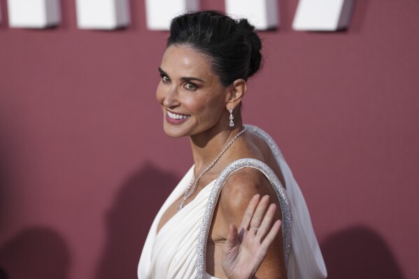 Demi Moore poses for photographers upon arrival at the amfAR Cinema Against AIDS benefit at the Hotel du Cap-Eden-Roc, during the 77th Cannes international film festival, Cap d'Antibes, southern France, Thursday, May 23, 2024. (Photo by Scott A Garfitt/Invision/AP)
