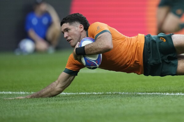 Australia's Ben Donaldson scores a try during the Rugby World Cup Pool C match between Australia and Georgia at the Stade de France in Saint-Denis, north of Paris, Saturday, Sept. 9, 2023. (AP Photo/Christophe Ena)