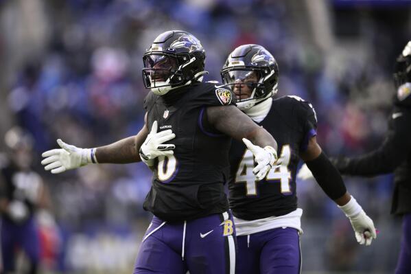 Baltimore Ravens linebacker Patrick Queen (6) and cornerback Marlon Humphrey (44) reacts after stopping the Atlanta Falcons on fourth down during the second half of an NFL football game, Saturday, Dec. 24, 2022, in Baltimore. (AP Photo/Nick Wass)