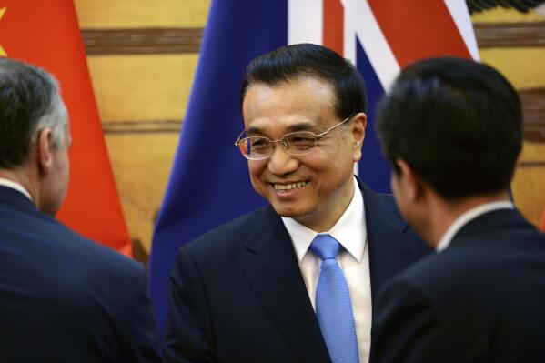 FILE - Chinese Premier Li Keqiang attends a signing ceremony with Australian Prime Minister Malcolm Turnbull at the Great Hall of the People in Beijing, China, on April 14, 2016. Li wrote to congratulate Australian Prime Minister Anthony Albanese on his election victory, which some Australian media reported on Tuesday, May 24, 2022, was a thawing of bilateral relations that Beijing put into deep freeze more than two years ago. (Parker Song/Pool Photo via AP, File)