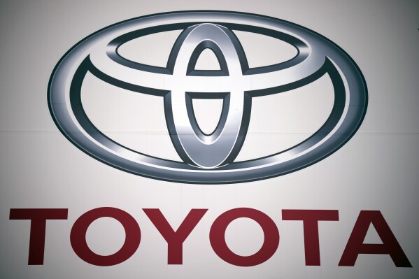 FILE - This photo shows a logo of Toyota Motor Corp. at a dealer on May 11, 2022, in Tokyo. Toyota raised its full fiscal year profit forecast Tuesday, Feb. 6, 2024 after reporting its profit in the October to December quarter nearly doubled from the year before. (AP Photo/Eugene Hoshiko, File)