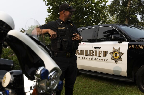 A Wicomico County police car appears on display during National Night Out, Tuesday, August 1, 2023, in Salisbury, Md. Data from the sheriff’s office shows that over the past eight years, children have been taken from Wicomico County schools to the emergency room for psychiatric evaluations at least 750 times. (AP Photo/Julia Nikhinson)