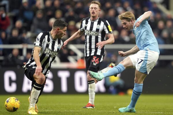 Manchester City's Kevin De Bruyne scores his side's second goal of the game, during the English Premier League soccer match between Newcastle United and Manchester City, at St. James' Park, in Newcastle upon Tyne, England, Saturday, Jan. 13, 2024. (Owen Humphreys/PA via AP)