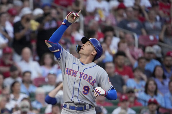 New York Mets' Brandon Nimmo arrives home after hitting a solo home run during the first inning of a baseball game against the St. Louis Cardinals Friday, Aug. 18, 2023, in St. Louis. (AP Photo/Jeff Roberson)