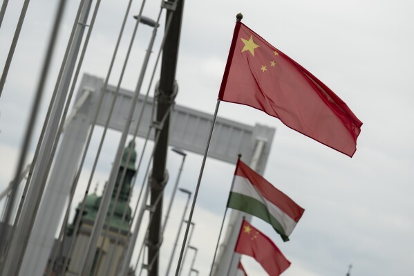 Chinese national flags are placed next to Hungarian flags on the Elisabeth Bridge in Budapest, Hungary, Wednesday, May 8, 2024. (AP Photo/Denes Erdos)