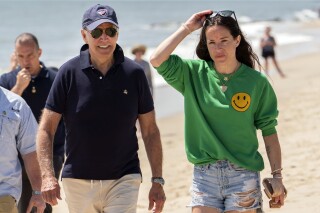 FILE - President Joe Biden walks on the beach with daughter Ashley Biden, June 20, 2022, in Rehoboth Beach, Del. Criminal prosecutors may soon get to see over 900 documents pertaining to the alleged theft of a diary belonging to Ashley Biden, after a judge on Thursday, Dec. 21, 2023, rejected a First Amendment claim by the conservative group Project Veritas. Attorney Jeffrey Lichtman said on behalf of Project Veritas on Monday, Dec. 25, that an appeal is being considered of the ruling. (AP Photo/Manuel Balce Ceneta, File)