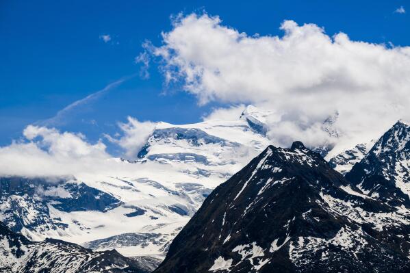 A view of the Grand-Combin massif, Switzerland, Friday, May 27, 2022. Swiss police say two mountaineers have been killed and nine other were injured after large chunks of glacier broke off an Alpine peak in southwest Switzerland. Regional Wallis police said seven rescue helicopters were deployed quickly after the breakage near the Grand-Combin range shortly after dawn in an area over 3,400 meters (11,100 feet) where 17 Alpinists had gathered in different groups. (Jean-Christophe Bott/Keystone via AP)