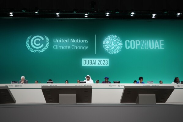FILE - COP28 President Sultan Al-Jaber, center, attends the opening session of the COP28 United Nations climate summit in Dubai, United Arab Emirates, Thursday, Nov. 30, 2023.  (AP Photo/Peter DeJong, File)