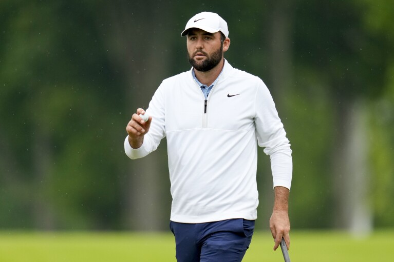 Scottie Scheffler celebrates after a birdie on the 10th hole during the second round of the PGA Championship golf tournament at the Valhalla Golf Club, Friday, May 17, 2024, in Louisville, Ky. (AP Photo/Jeff Roberson)