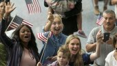
              Family members react as they welcome their relatives as new U.S. citizens after taking the citizenship oath during naturalization ceremonies at a U.S. Citizenship and Immigration Services (USCIS) ceremony in Los Angeles Wednesday, Sept. 20, 2017. President Donald Trump has issued a videotaped message that is being played for new American citizens at naturalization ceremonies in which he welcomes immigrants to "the American family." (AP Photo/Damian Dovarganes)
            
