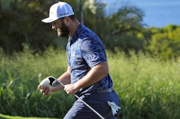 Jon Rahm, of Spain, walks off the 14th green during the first round of the Tournament of Champions golf event, Thursday, Jan. 5, 2023, at Kapalua Plantation Course in Kapalua, Hawaii. (AP Photo/Matt York)