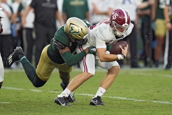 Alabama quarterback Ty Simpson (15) is sacked by South Florida defensive end Jason Vaughn during the second half of an NCAA college football game Saturday, Sept. 16, 2023, in Tampa, Fla. (AP Photo/Chris O'Meara)