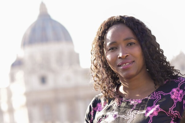 Southern African Catholic Bishops' Conference Communication Officer Sheila Pires poses for a portrait at The Vatican, Friday, Sept. 29, 2023. Pires has been invited to take part in the next synod of bishops starting Oct. 4. “I think the church has just come to a point of realization that the church belongs to all of us, to all the baptized,” she says. Of the 365 voting members, only 54 are women and organizers insist the aim is to reach a consensus, not tally votes like a parliament. But the voting reform is nevertheless significant, tangible evidence of Francis’ vision of the Catholic Church as being more about its flock than its shepherds. (AP Photo/Domenico Stinellis)