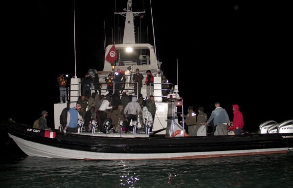 FILE - Migrants, mainly from sub-Saharan Africa, are stopped by Tunisian Maritime National Guard at sea during an attempt to get to Italy, near the coast of Sfax, Tunisia, Tuesday, April 18, 2023. The bodies of 19 people were recovered Tuesday, April 23, 2024, off the coast of Tunisia, one of the primary points of departure for those seeking to traverse the Mediterranean Sea to Europe. More than 49,000 people have come to Europe by sea this year, including more than 7,000 from Tunisia to Italy. (AP Photo, File)
