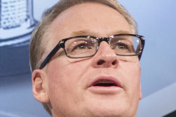 FILE - Keith Pelley, then president of Rogers Media Division at Rogers Communications, attends a news conference in Toronto, Canada, Tuesday, Nov. 26, 2013. Keith Pelley is leaving his role as chief executive of the European tour while the organization remains in negotiations with the PGA Tour and Saudi Arabia’s Public Investment Fund to strike a deal over the future of golf. The tour says the 60-year-old Pelley was taking a job in his native Canada as president and chief executive of Maple Leaf Sports and Entertainment. (AP Photo/The Canadian Press, Chris Young, File)