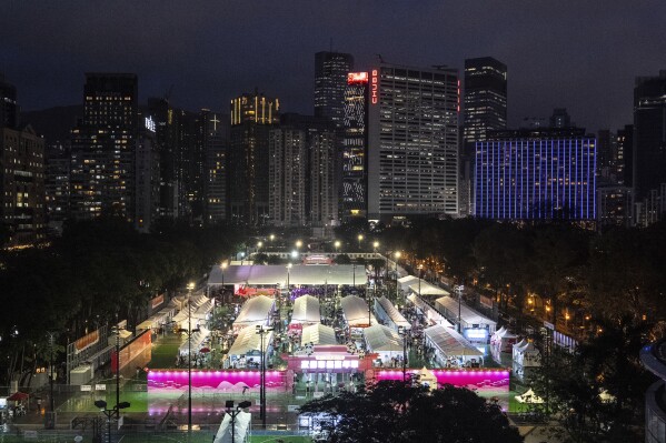 A Pro-Beijing market at the Victoria Park, the city's venue for the annual 1989 Tiananmen massacre vigil, on the 36th anniversary of China's Tiananmen Square crackdown, in Hong Kong, Wednesday, June 4, 2025. (AP Photo/Chan Long Hei)