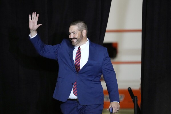 Maricopa County Recorder candidate and Arizona State Rep. Justin Heap, R-Phoenix, arrives on stage to speak during a campaign event Tuesday, Oct. 22, 2024, in Peoria, Ariz. (AP Photo/Ross D. Franklin, File)