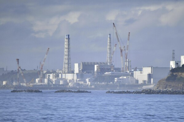 Fukushima Daiichi nuclear plant is seen from Namie, Fukushima prefecture, Japan Tuesday, Aug. 22, 2023. Japan will start releasing treated and diluted radioactive wastewater from the Fukushima Daiichi nuclear plant into the Pacific Ocean as early as Thursday, a controversial but essential early step in the decades of work to shut down the facility 12 years after its meltdown disaster. (Kyodo News via AP)