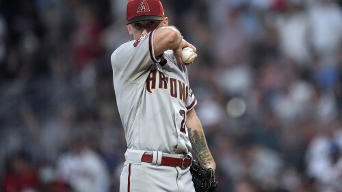 Arizona Diamondbacks starting pitcher Zach Davies (27) waits on the mound for manager Torey Lovullo to relieve him in the fourth inning of a baseball game against the Atlanta Braves Tuesday, July 18, 2023, in Atlanta. (AP Photo/John Bazemore)