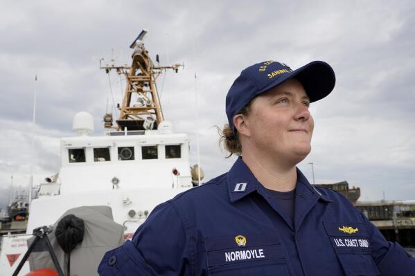 U.S. Coast Guard Lt. Kelli Normoyle, Commanding Officer of the Coast Guard Cutter Sanibel, stands for a photograph on the deck of the vessel, Thursday, Sept. 16, 2021, at a shipyard, in North Kingstown, R.I. Normoyle was one of two cadets who formally started the process to create the CGA Spectrum Diversity Council just a few months after the law known as "don't ask, don't tell" was repealed on Sept. 20, 2011. (AP Photo/Steven Senne)