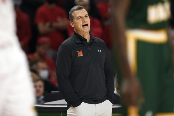 FILE - Maryland head coach Mark Turgeon reacts during the first half of an NCAA college basketball game against George Mason on Nov. 17, 2021, in College Park, Md.   Turgeon is out as Maryland's basketball coach after a slow start to his 11th season knocked the team out of the Top 25. The athletic department announced Friday, Dec. 3, 2021, that Turgeon was stepping down in what it called a mutual decision. (AP Photo/Nick Wass, File)