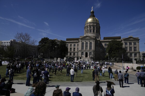 People attend a Stand up for Science rally in Liberty Plaza near the Georgia State capitol on Friday, March 7, 2025, in Atlanta. (AP Photo/Brynn Anderson)