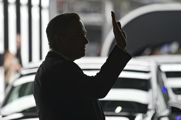 FILE - Elon Musk, Tesla CEO, attends the opening of the Tesla factory Berlin Brandenburg in Gruenheide, Germany, Tuesday, March 22, 2022.  Many people are puzzled on what a Elon Musk takeover of Twitter would mean for the company and even whether he’ll go through with the deal.  If the 50-year-old Musk’s gambit has made anything clear it’s that he thrives on contradiction.   (Patrick Pleul/Pool via AP, File)