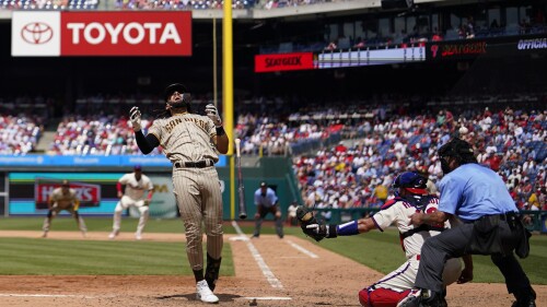 San Diego Padres' Fernando Tatis Jr. is hit by a pitch from Philadelphia Phillies' Yunior Marte during the seventh inning of the first baseball game in a doubleheader, Saturday, July 15, 2023, in Philadelphia. (AP Photo/Matt Slocum)