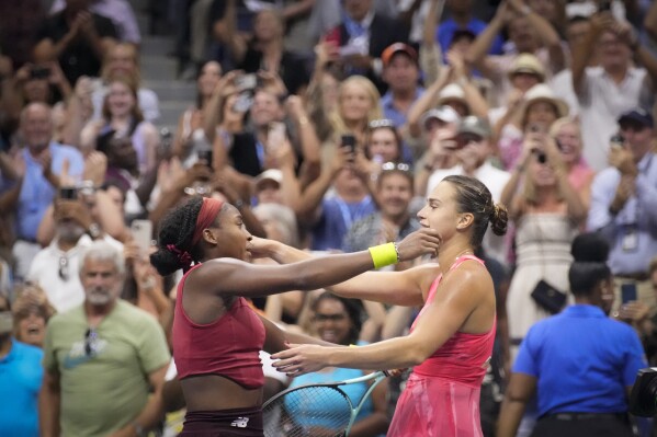 Coco Gauff, of the United States, embrace Aryna Sabalenka, of Belarus, after wining their match during the women's singles final of the U.S. Open tennis championships, Saturday, Sept. 9, 2023, in New York. (AP Photo/Charles Krupa)