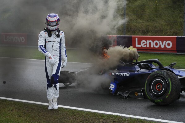 Williams driver Logan Sargeant of the US walks away from his car after he crashed during the third free practice ahead of the Formula One Dutch Grand Prix race at the Zandvoort racetrack, Netherlands, Saturday, Aug. 24, 2024. (AP Photo/Peter Dejong)