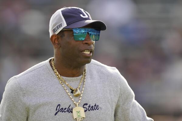 Jackson State head coach Deion Sanders surveys his players during warmups prior to the Southwestern Athletic Conference championship NCAA college football game against Southern University, Saturday, Dec. 3, 2022, in Jackson, Miss. Jackson State won 43-24. (AP Photo/Rogelio V. Solis)
