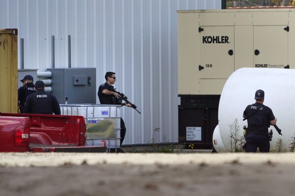 FILE - Law enforcement search a farm for the Army reservist Robert Card following deadly mass shootings, Oct. 27, 2023, in Lisbon, Maine.  (AP Photo/Robert F. Bukaty, File)