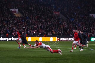 Slavia's players celebrate after the Europa League group G soccer match between Slavia Praha and AS Roma at the Fortuna arena in Prague, Czech Republic, Thursday, Nov. 9, 2023. (AP Photo/Petr David Josek)